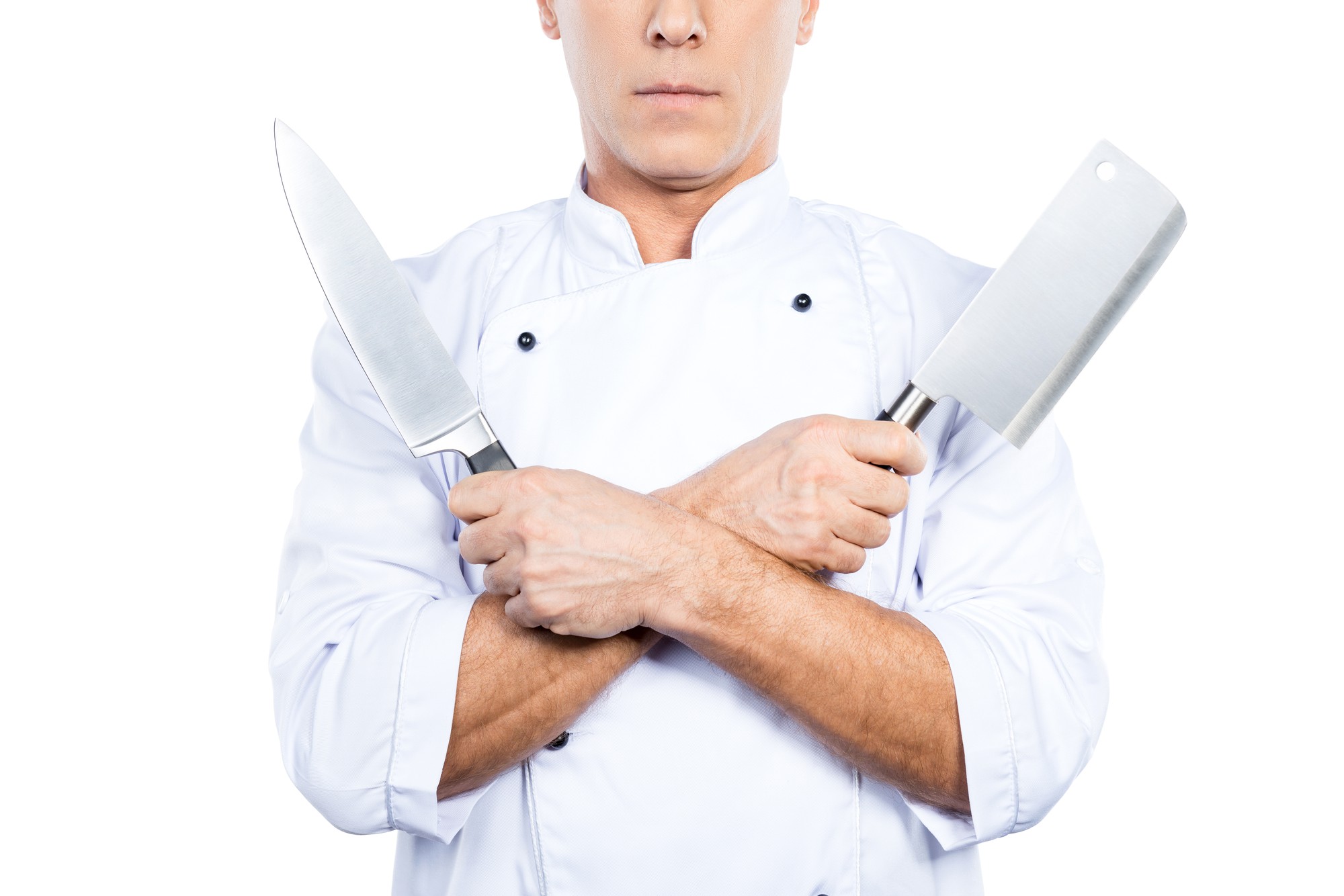 Profesjonalny szef demonstrujący technikę krojenia